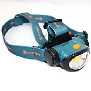Firelight 200 Lumen LED headlamp worn on adjustable head strap, powered by 3 included AAA batteries for up to 8 hours of use